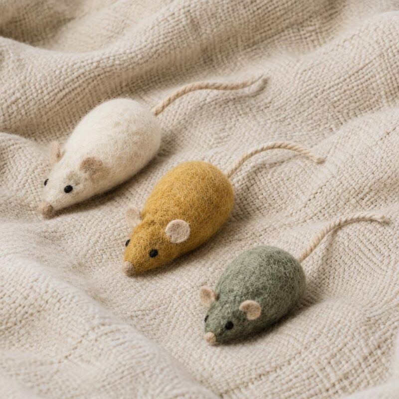 Three felted wool cat toy mice in cream, mustard and sage